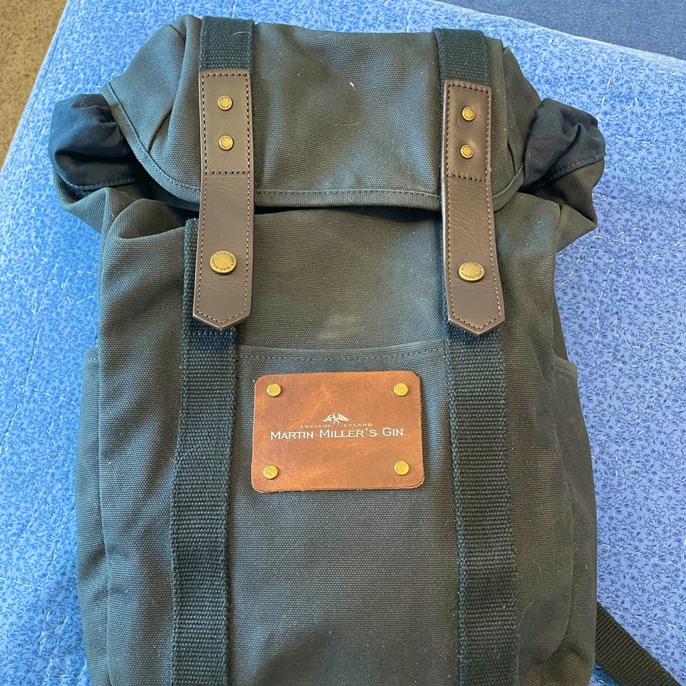 Lands End Wax Canvas Backpack with laptop slip and padded straps.